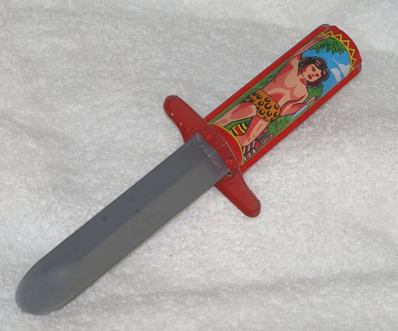 Spring Trick Knife with Tarzan Theme Tin Litho Handle about 1960